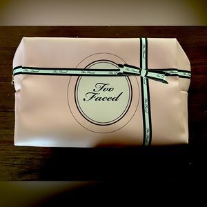 - Too faced makeup bag. Light pink